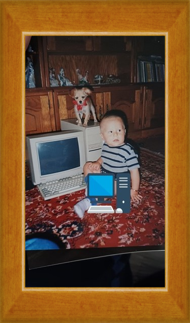 1year 1month old Andrei next to a computer